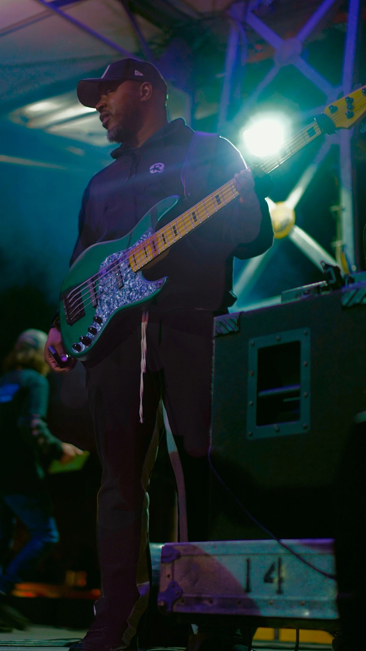Ryan Johnson on stage with bass
